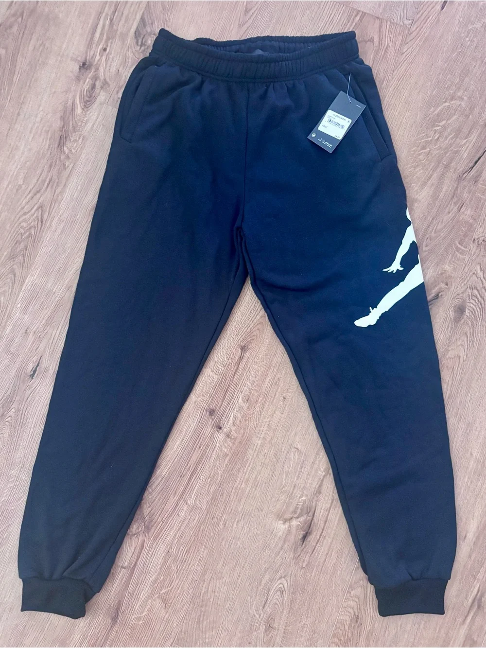 Brand New with Tags: Men’s Black Jordan Jogger Pants with White Jumpman Graphic